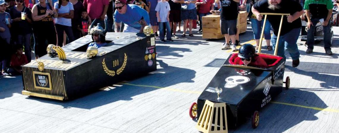 The rules of the event specify wood or plastic construction (with the exception of push bars and wheels), no steering mechanism (though wheels may swivel for easier turning) — and absolutely no propulsion other than pushing by the teams. 