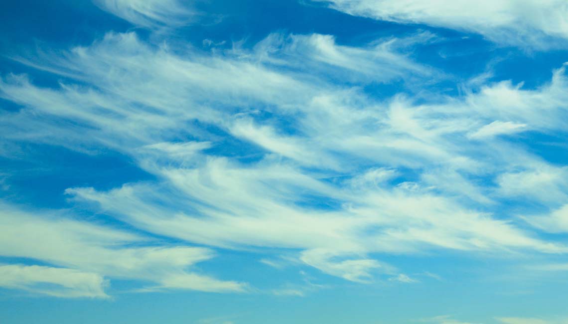 Wispy mare's tails are the advance clouds of a weather front.
