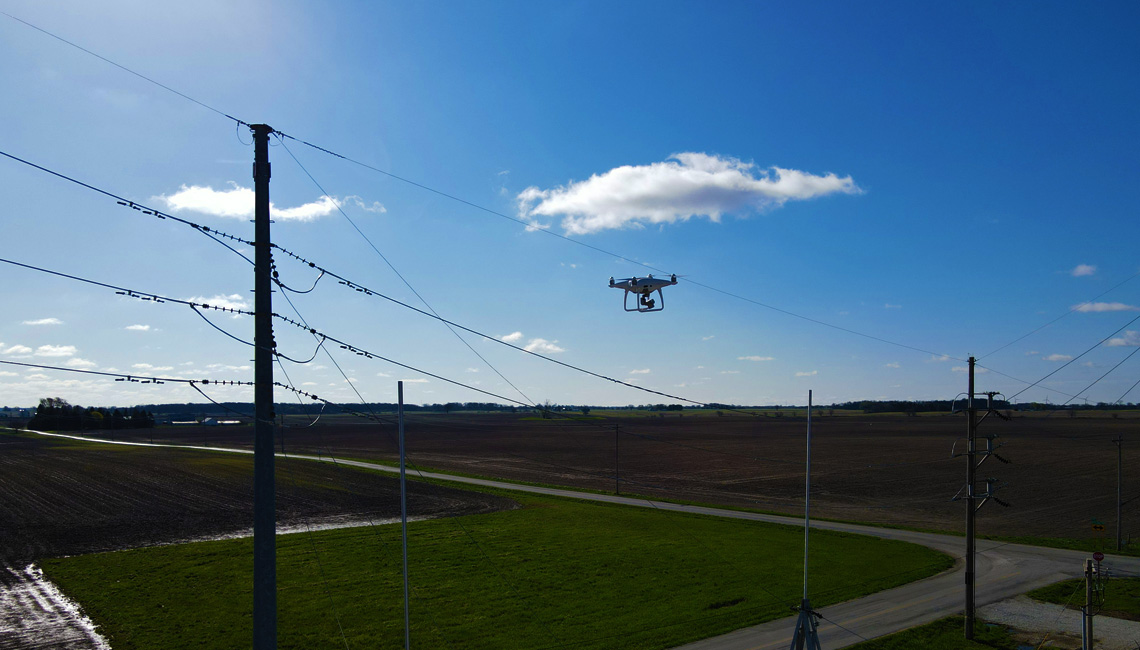 Drone in the sky near power lines