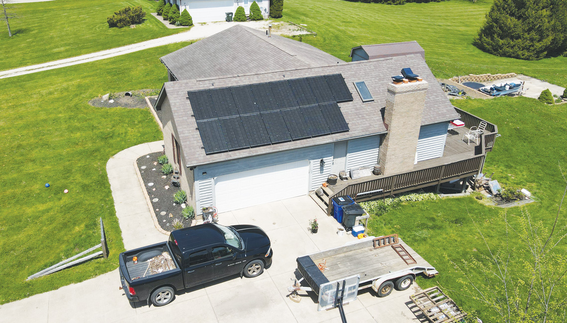Overhead view of home with solar panels on roof