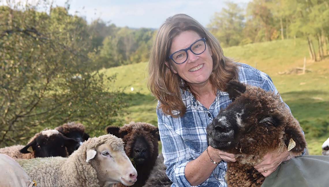 Cheryl Dunlap with her flock of sheep.