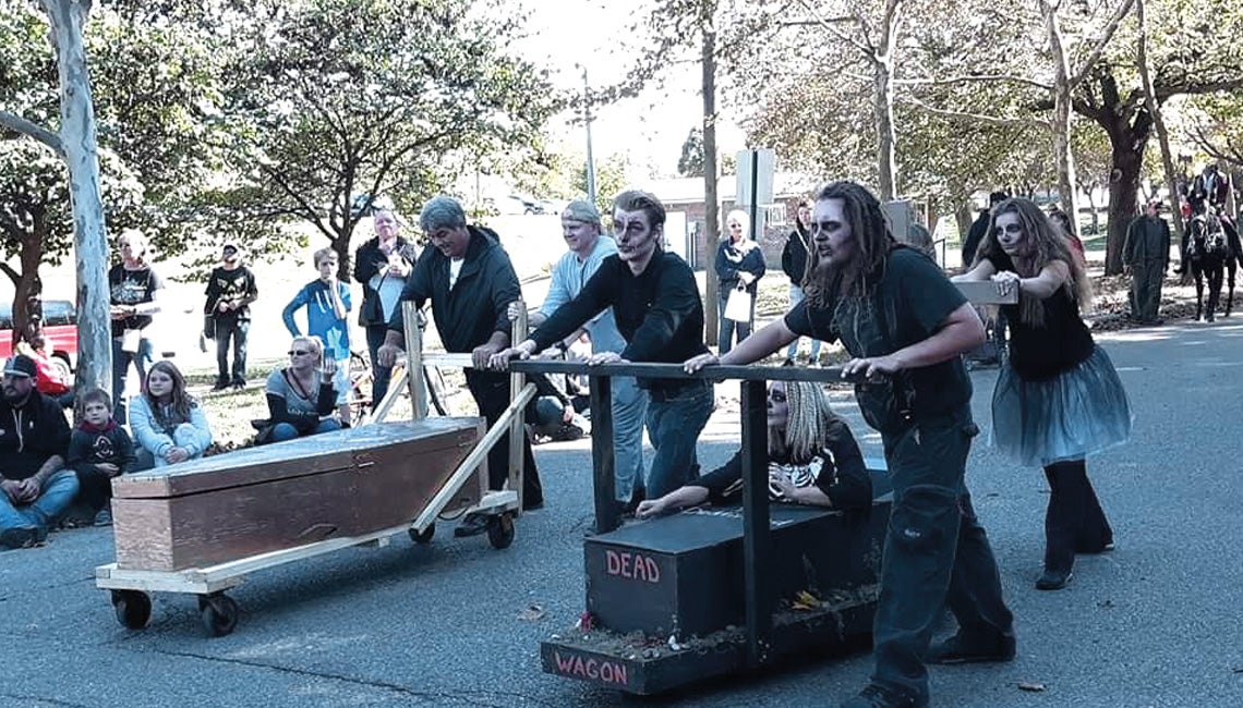 Halloween festival’s unique races challenge teams, delight spectators.