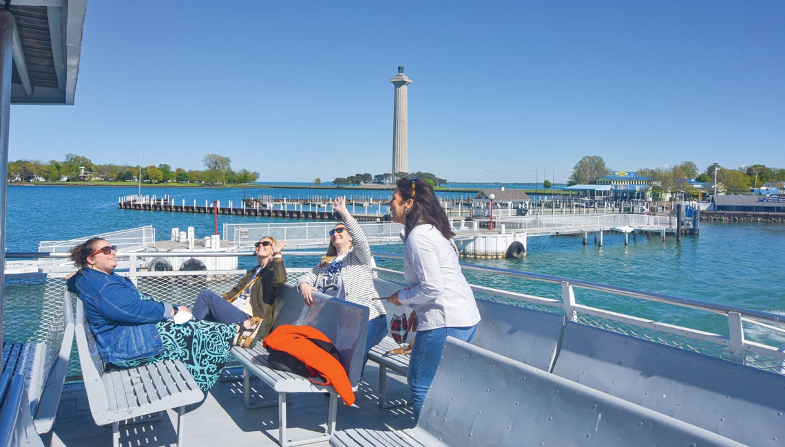 Passengers on the upper deck of a ferry.