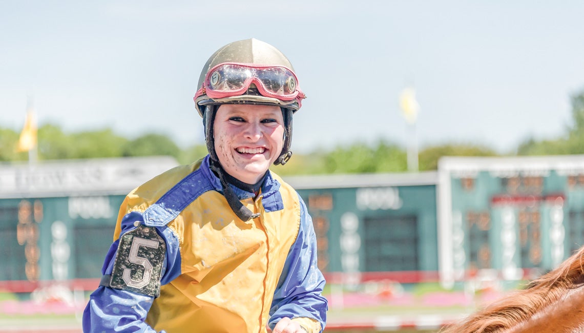 A woman jockey on horsebackChelsey Keiser vividly remembers growing up in western Ohio and helping her parents, Darke Rural Electric Cooperative members Mike and Debbie Keiser, raise thoroughbreds at their North Star-area farm.  “My first horse was a pony with a yellowish coat,” she remembers with a chuckle. “I called him ‘Black Beauty.’” Keiser, now 32, never lost her fascination with horses. A 5-foot, 3-inch bundle of energy, she’s living her dream as a professional jockey, compiling an impressive record 