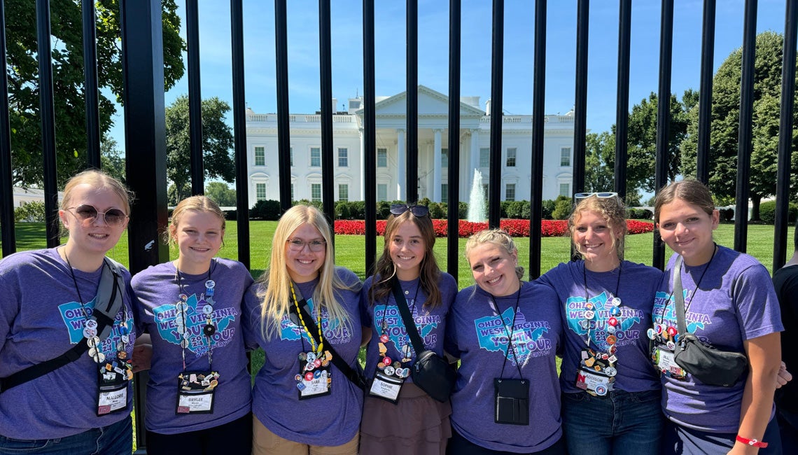 Group of Youth Tour delegates posing in front of the White House