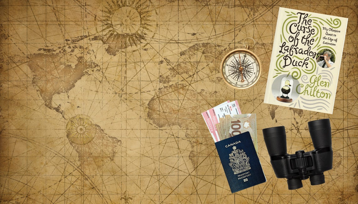 A map with binoculars, a passport, and a compass.