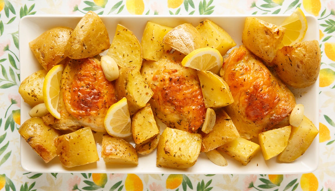 A plate of potatoes and chicken