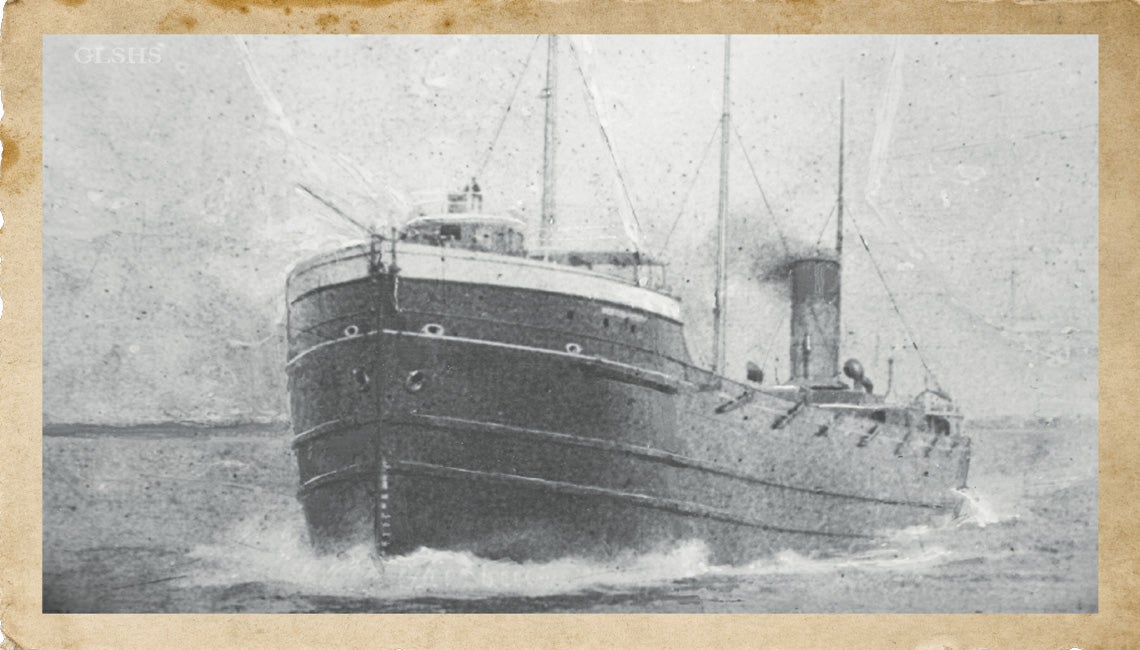 A black and white photo of a ship at sail
