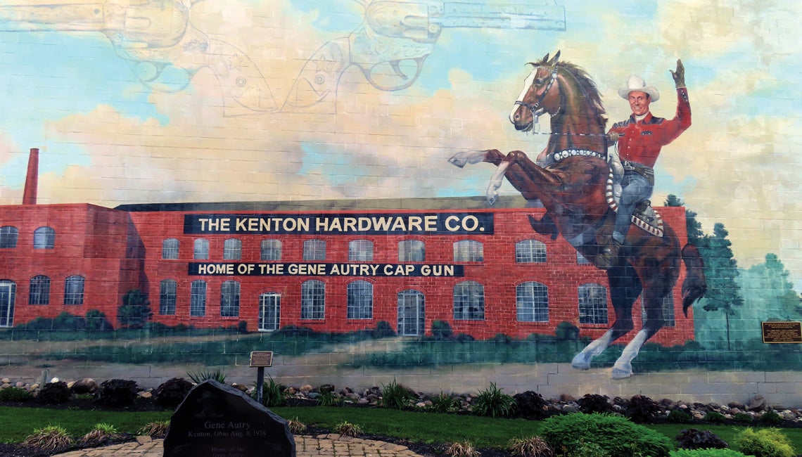 A mural of The Kenton Hardware Co. and a cowboy on the side of a building