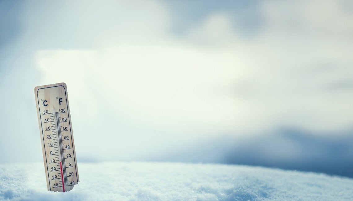 A thermometer stuck in a snowy field