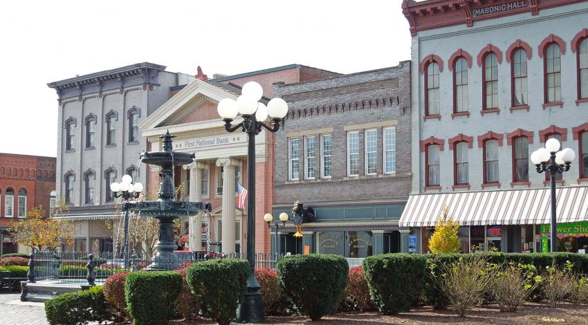 A picture of a fountain and buildings in Nelsonville