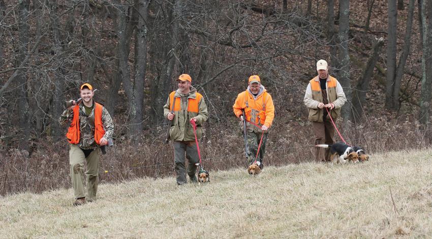 Four guys holding on to what is becoming a lost art: Scott Lynch, Dave Miller, Greg Thomas (also shown at left), and Rick Truman, hunting with their beagles.