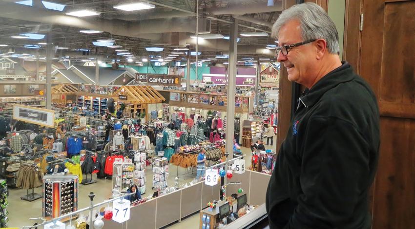 Owner Howard Miller watches customers roam the floor of his hardware store in Hartville.