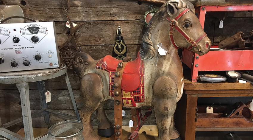 A toy horse sits in a toy store.