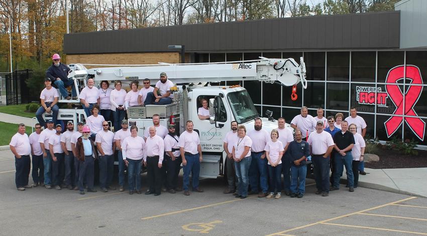 The employees of Pioneer pose for a group picture.