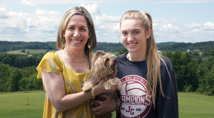 Teresa Harshbarger, her daughter Alexa and their puppy, Ashley, smile for a photo.