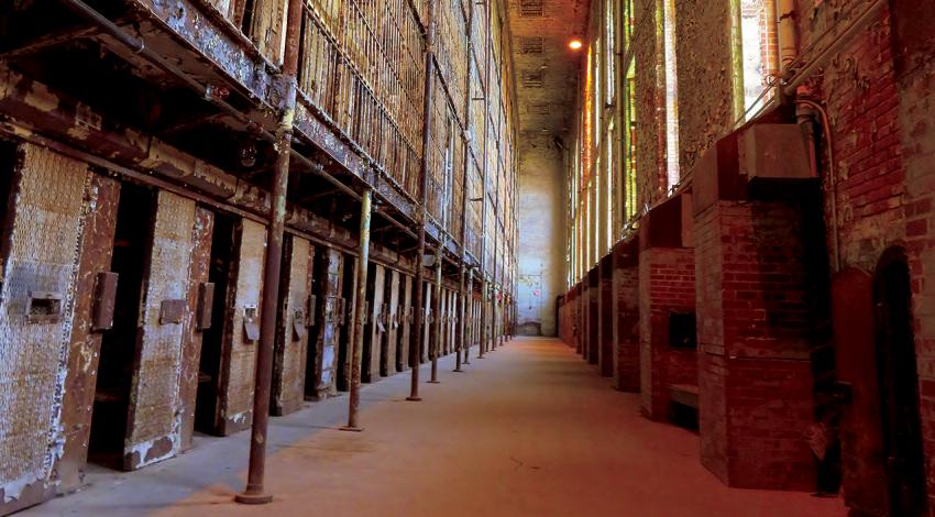 An inside view of the Ohio State Reformatory featuring old cells.