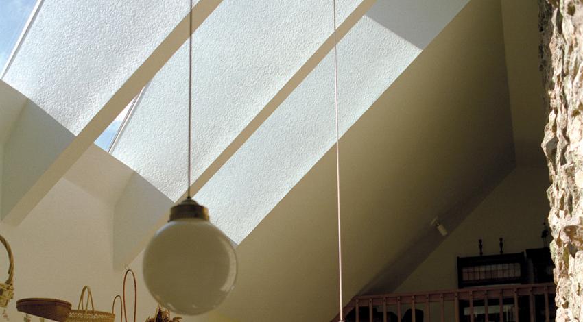 A picture of skylights brightening a room.