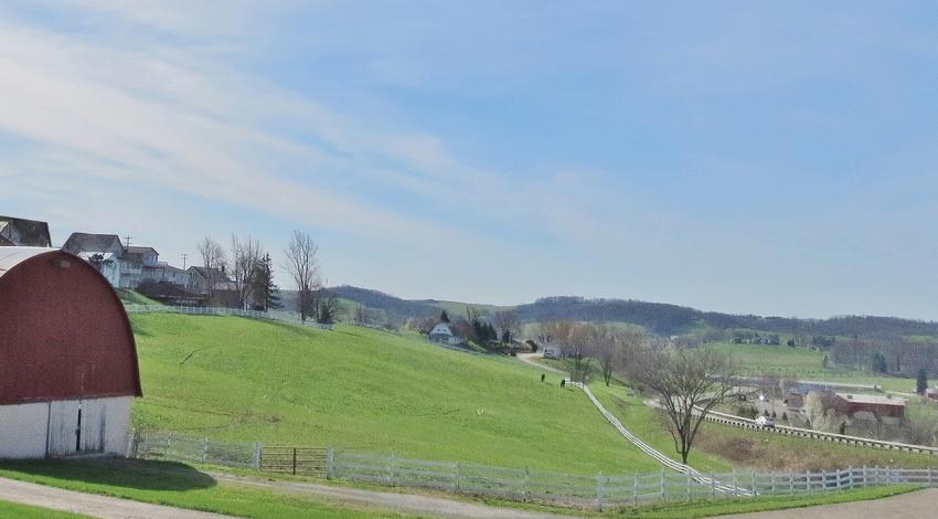 A photo of a barn and hill at Walnut Creek