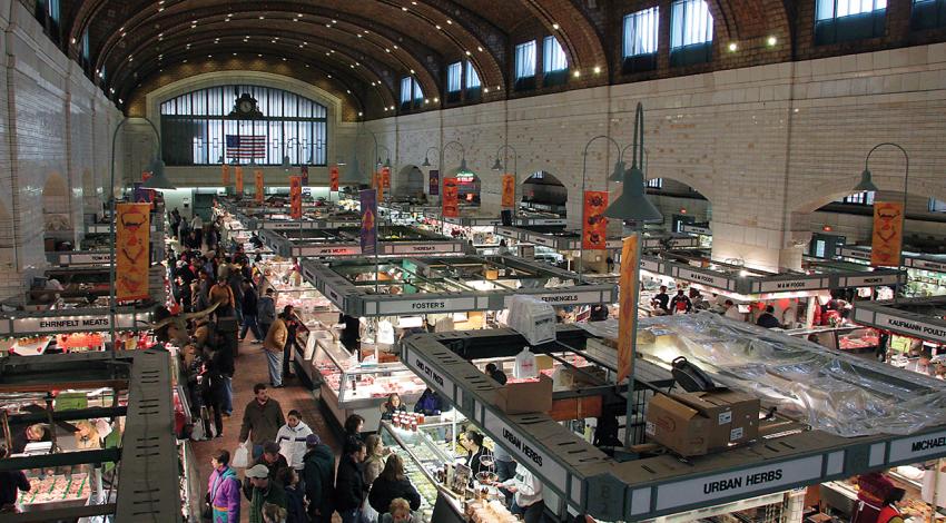 A photo of Cleveland's West Side Market from above as vendors and visitors mingle below.