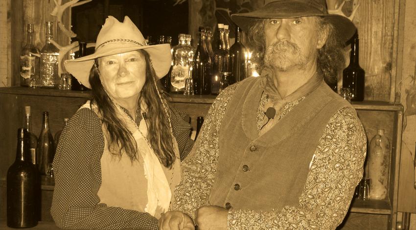 Owners Mike and Sharlene Montgomery stay in character while manning the saloon.   