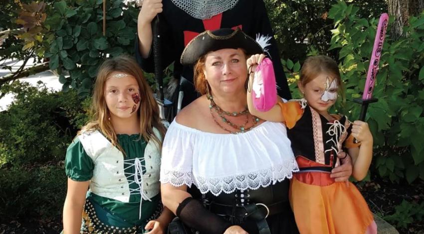 Peggy Kelly (pictured at center) attends the Ohio Renaissance Festival both alone and with her family during the course of the event. 