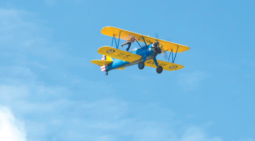 A vintage airplane flying in the sky.