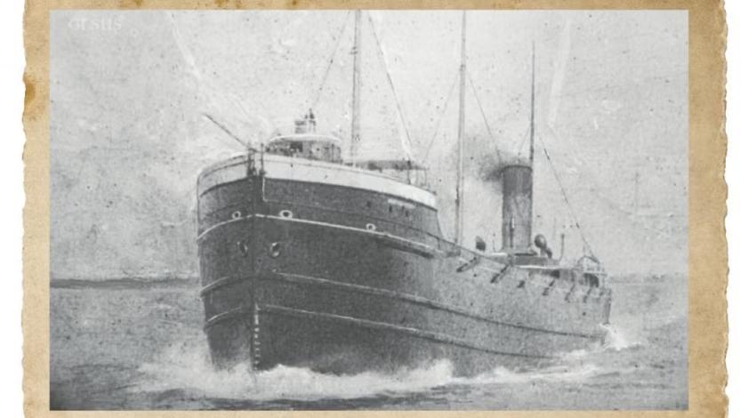 A black and white photo of a ship at sail