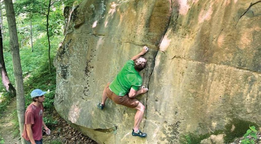 A man free solo climbing