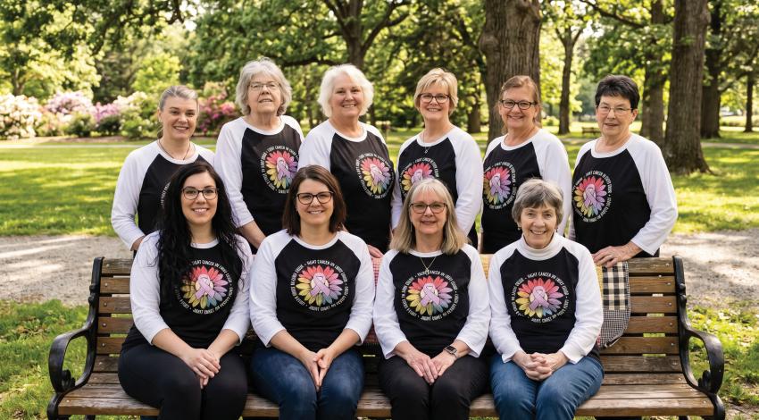 A group of women posing outdoors
