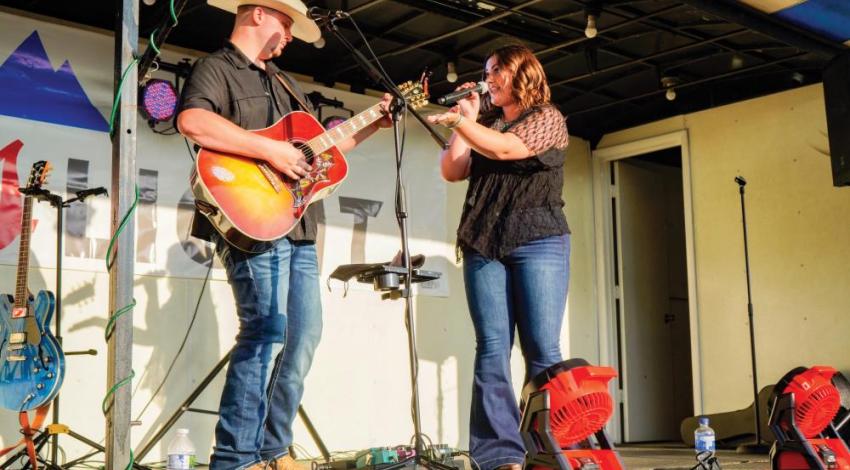 Dalton Hesson and Delaney Moore performing together on stage