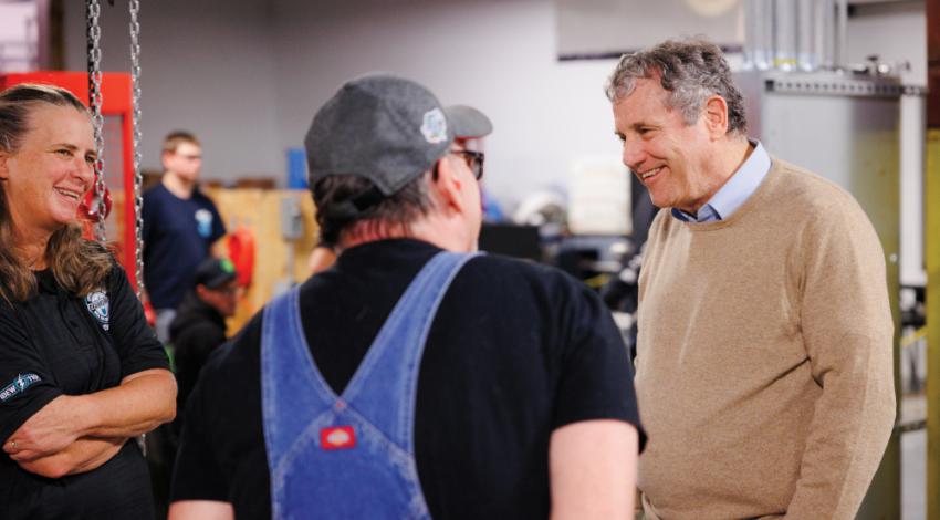 Sherrod Brown meeting with a group of people