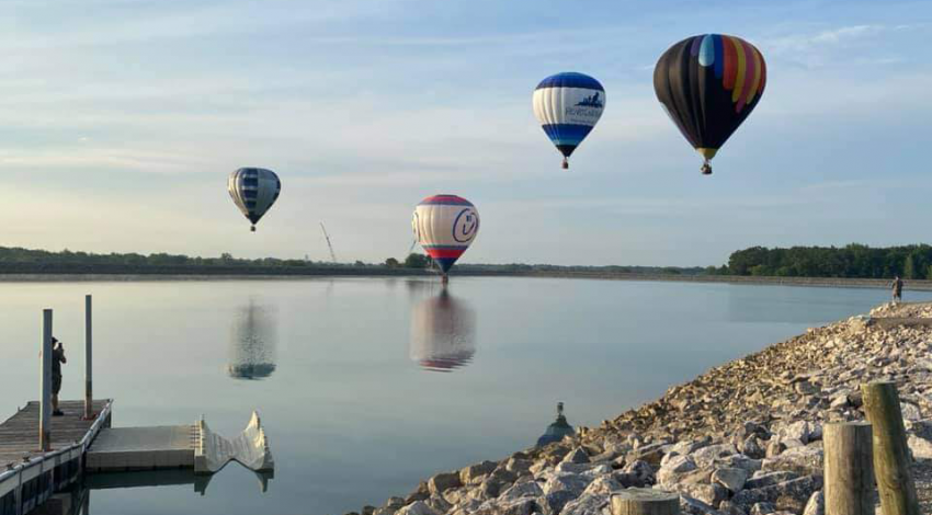 Hot air balloons fly over the up-ground reservoir in Marysville. Photo credit: Anne Dodge