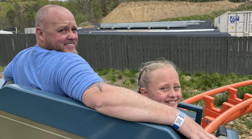man and girl on roller coaster