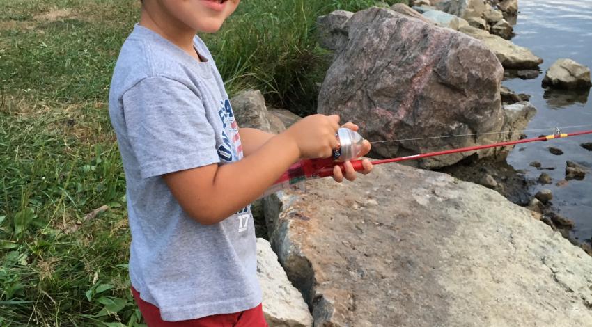 smiling boy fishing