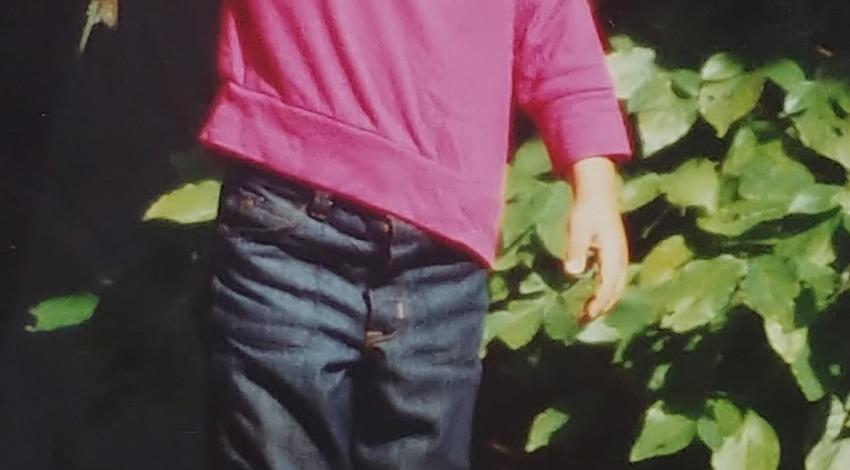 Boy proudly holds a fish