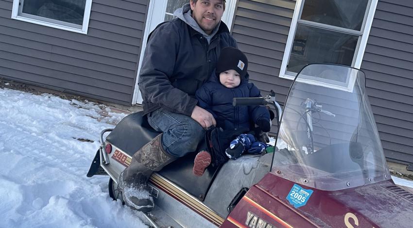 Boy on snowmobile