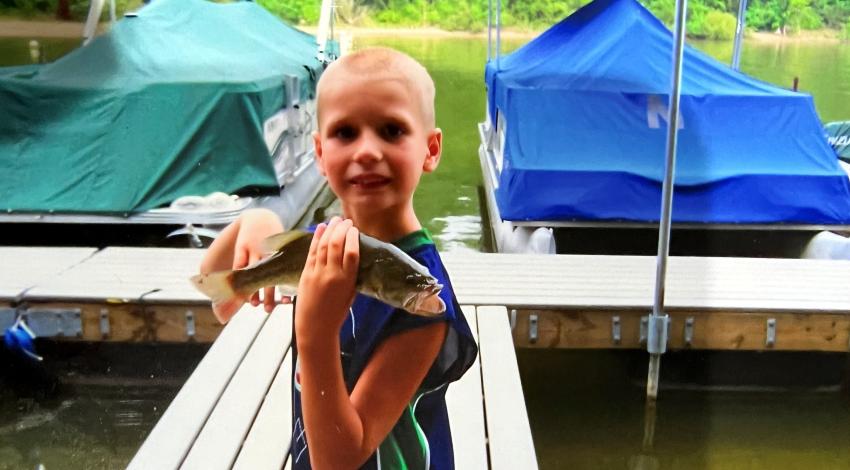 Boy holding a fish