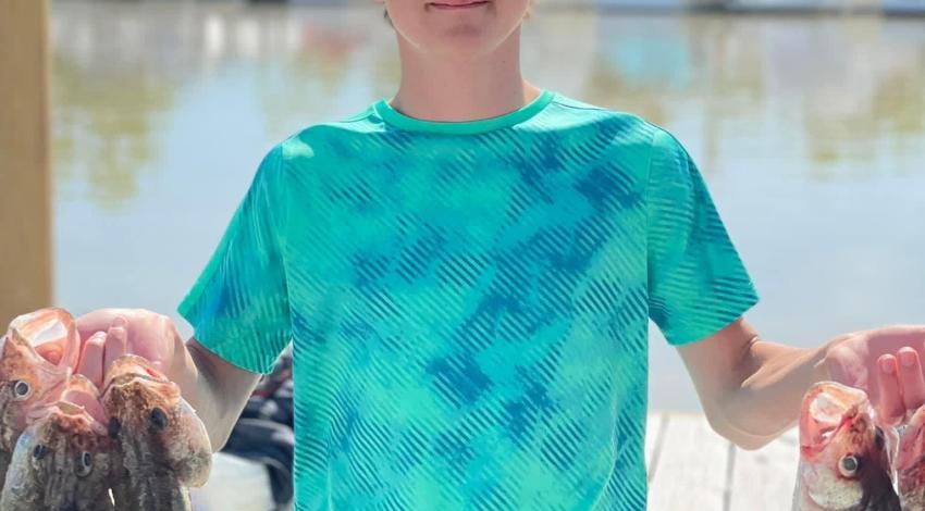 boy holding fish