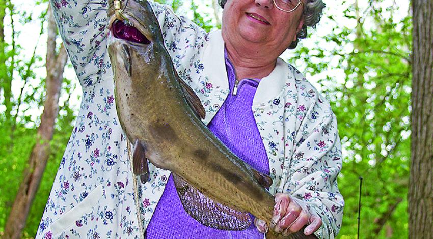 woman holding a large fish