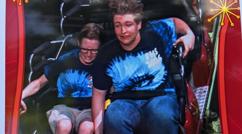 two people on roller coaster