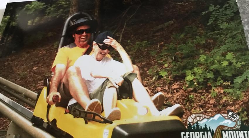Man and woman on mountain coaster