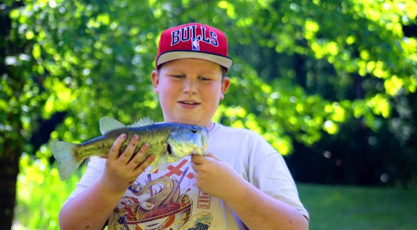 Boy holding a fish