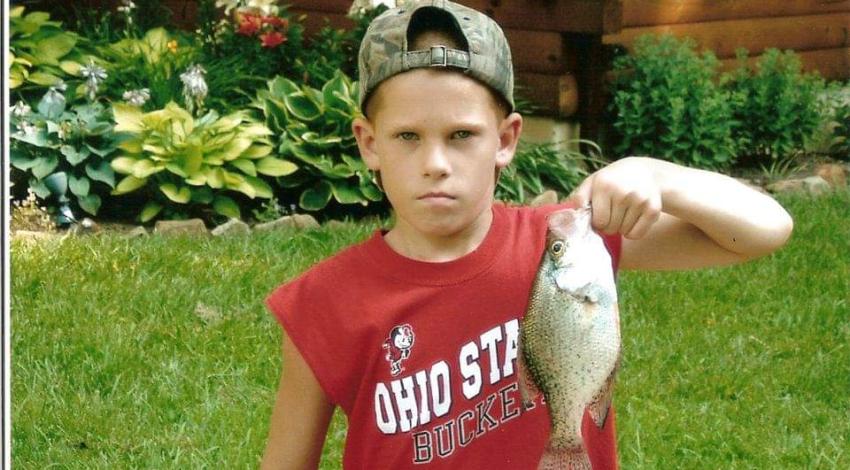 Boy holding a fish