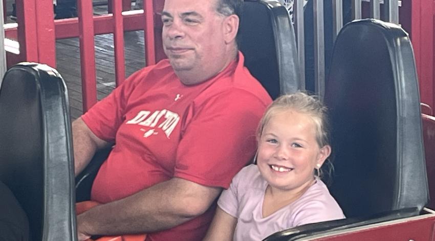 girl and man on roller coaster