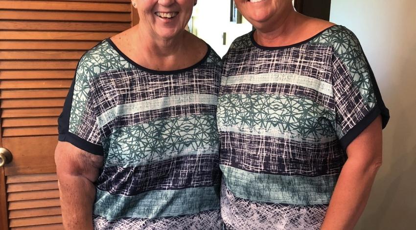 two women in matching shirts