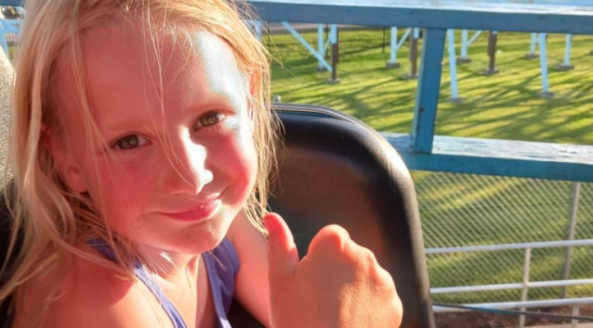 little girl on roller coaster