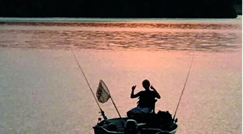 person fishing in a boat