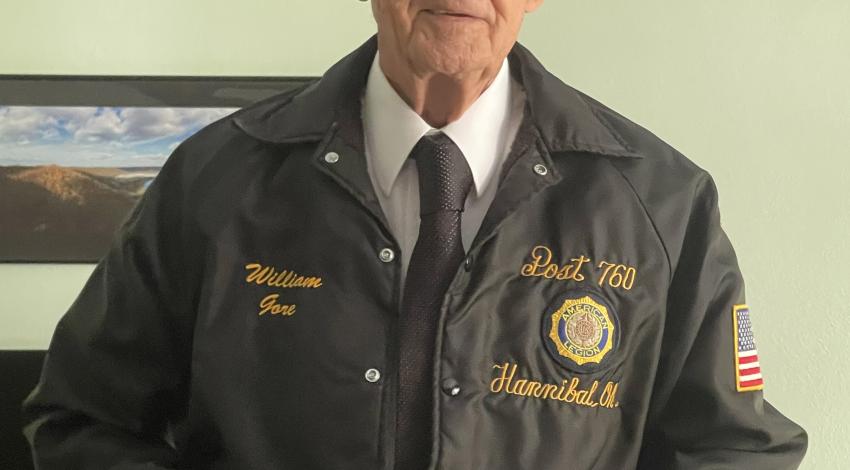 man in American Legion jacket and hat
