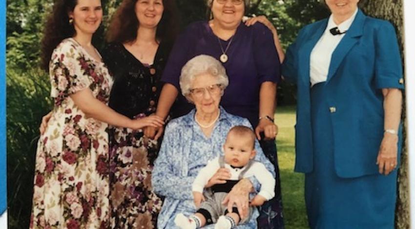 five women and a baby outdoors